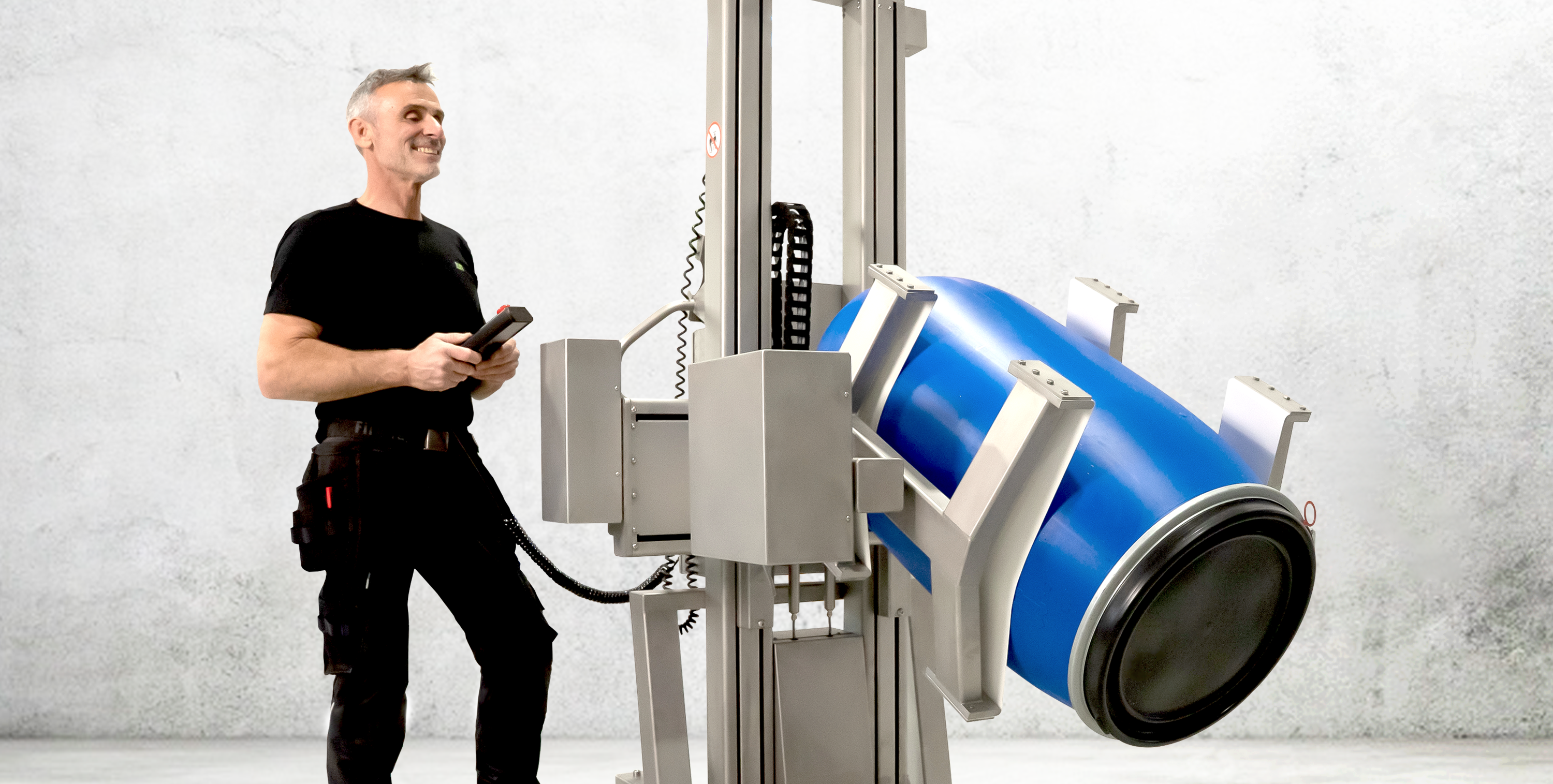 Industrial electric drum handler with an electric clamp mounted on a rotation unit.
